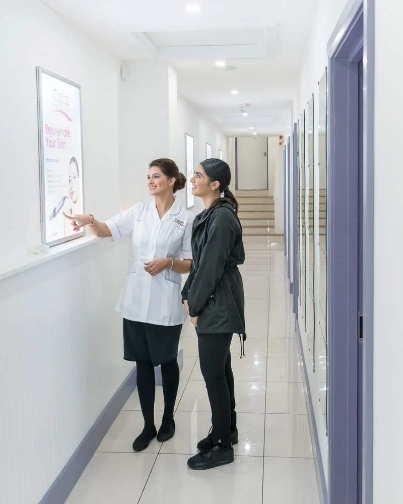 Alaiyka Parvez points out a treatment programme to a CoLaz patient at the Wembley clinic, photographed in 2018