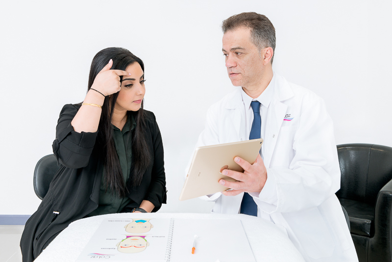coLaz clinician reviewing an anti-wrinkle treatment plan with a patient in the consultation room